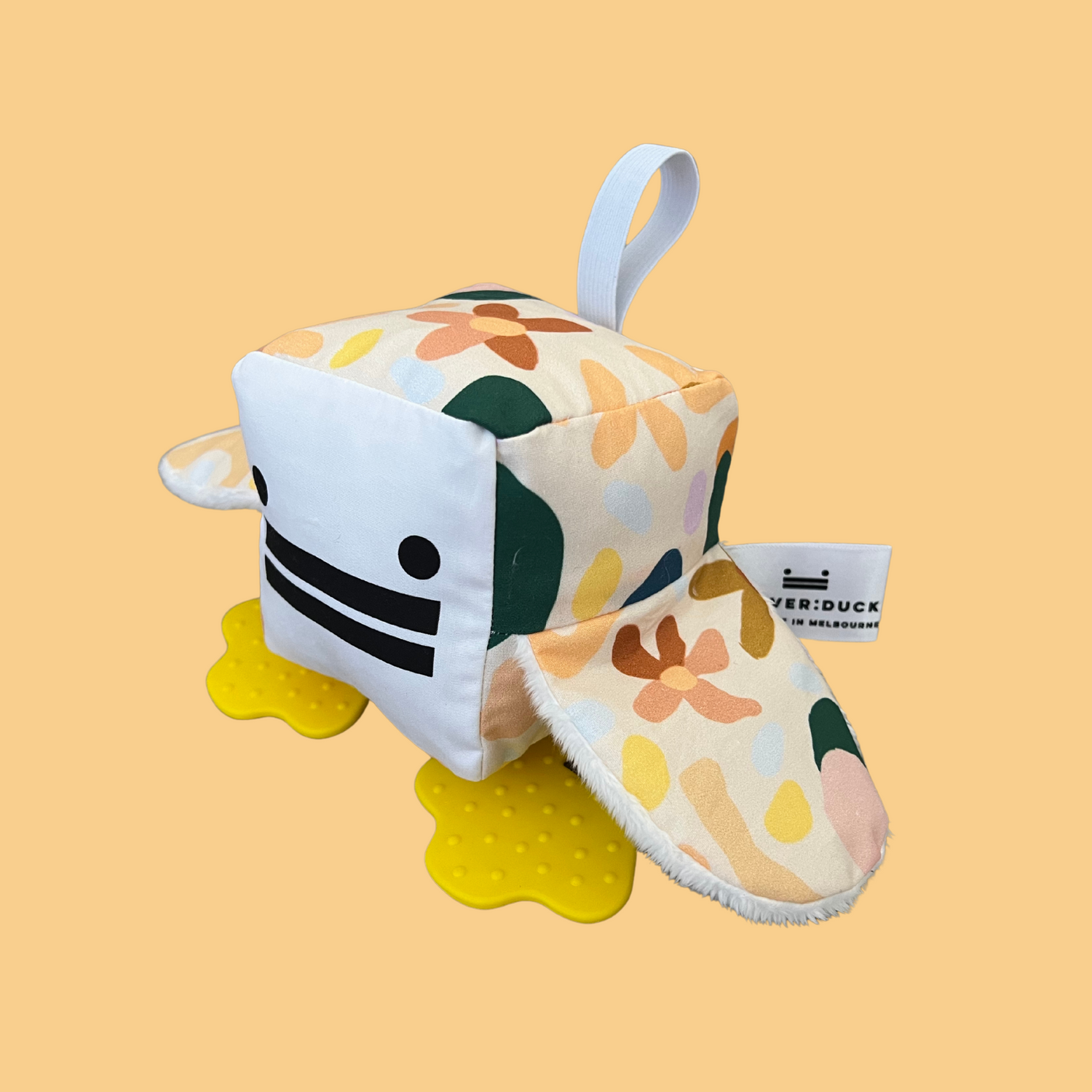 Eco-friendly and Australian-made handmade baby sensory toy — flower patterned duck with soft fabric wings and safe chewable teething feet. Montessori-inspired toy for babies to encourage sensory development, teething relief, and independent play. Perfect unique baby shower gift for new parents.