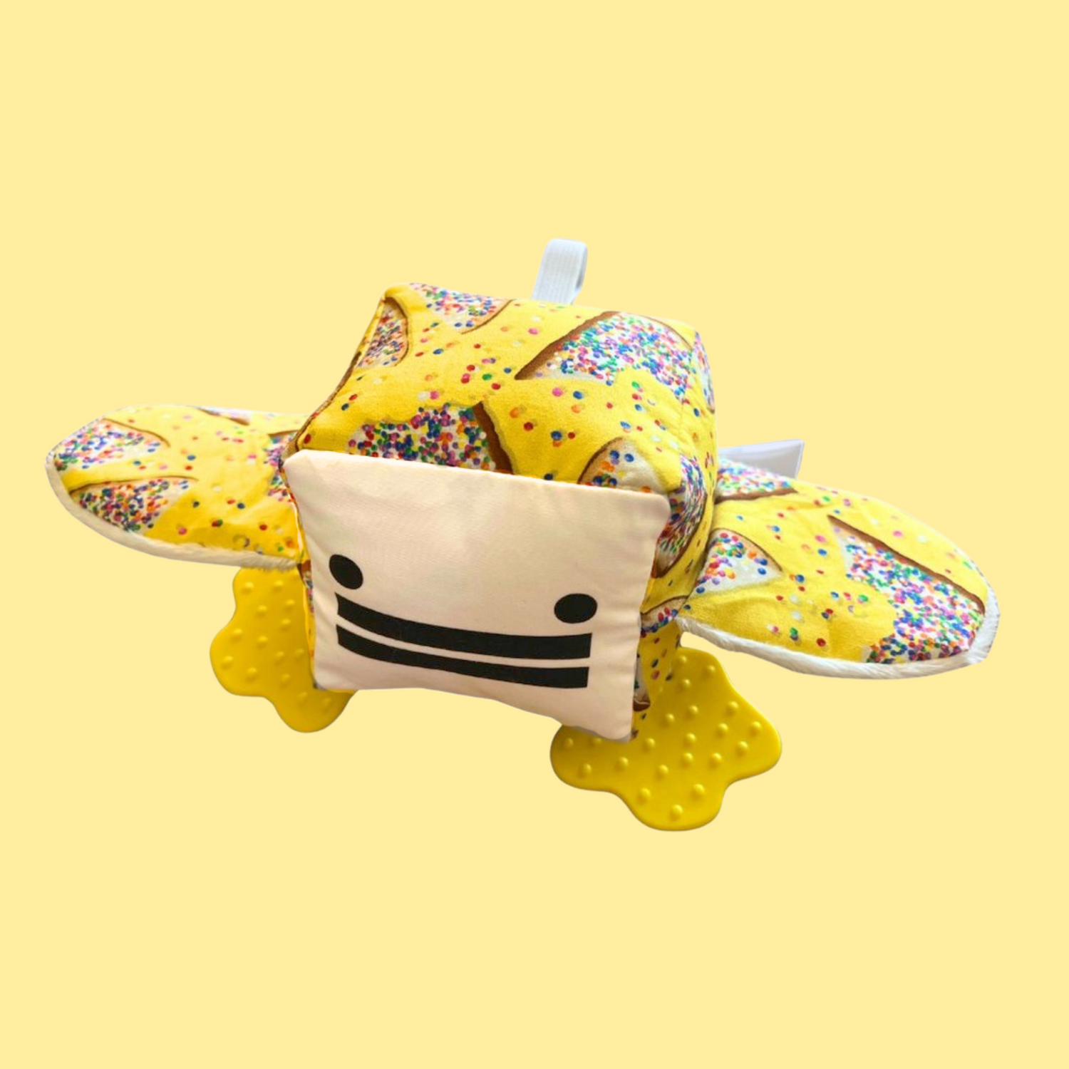 Eco-friendly and Australian-made handmade baby sensory toy — fairy bread pattern duck with soft fabric wings and safe chewable teething feet. Montessori-inspired toy for babies to encourage sensory development, teething relief, and independent play. Perfect unique baby shower gift for new parents.