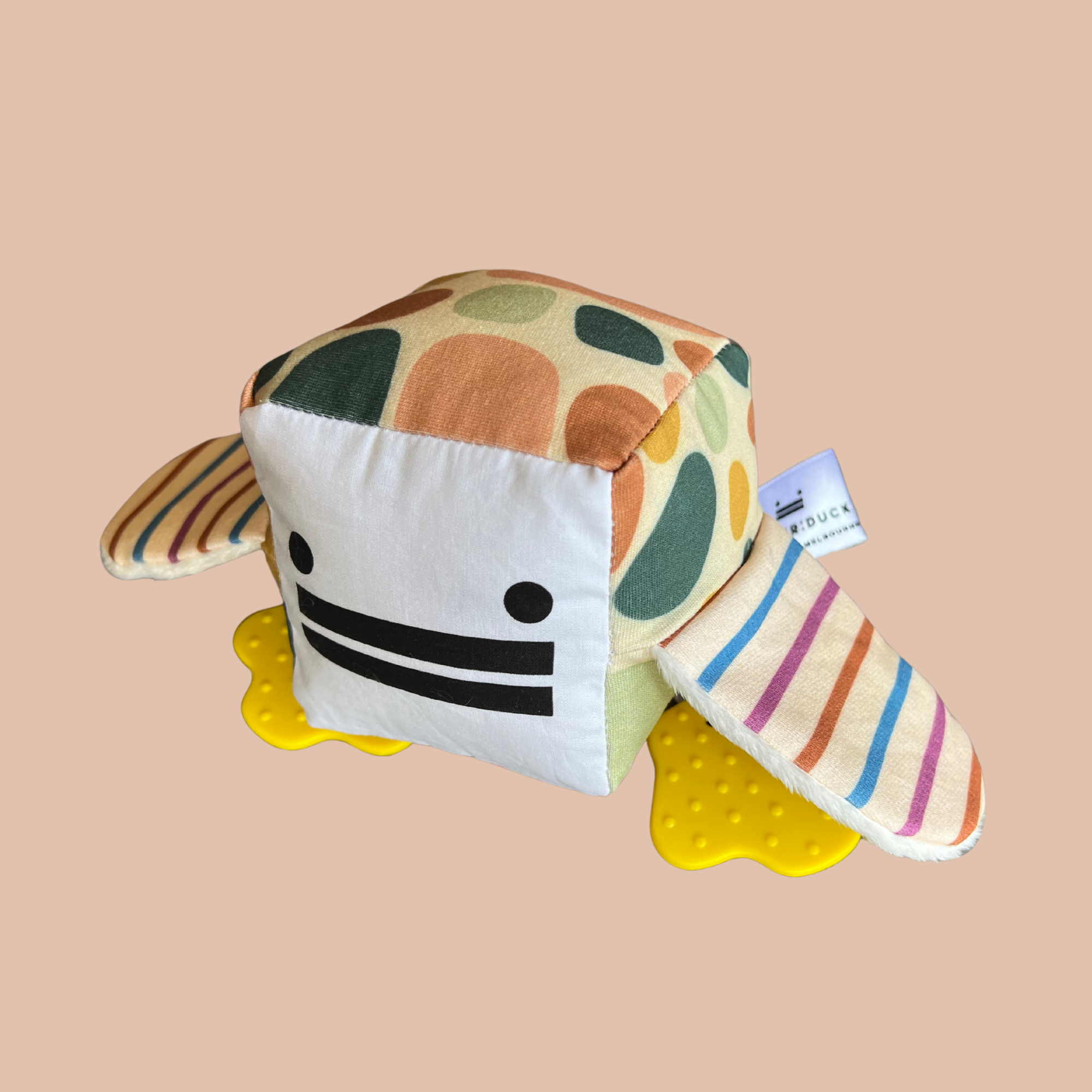 Eco-friendly and Australian-made handmade baby sensory toy — neutral patterned duck with soft fabric wings and safe chewable teething feet. Montessori-inspired toy for babies to encourage sensory development, teething relief, and independent play. Perfect unique baby shower gift for new parents.