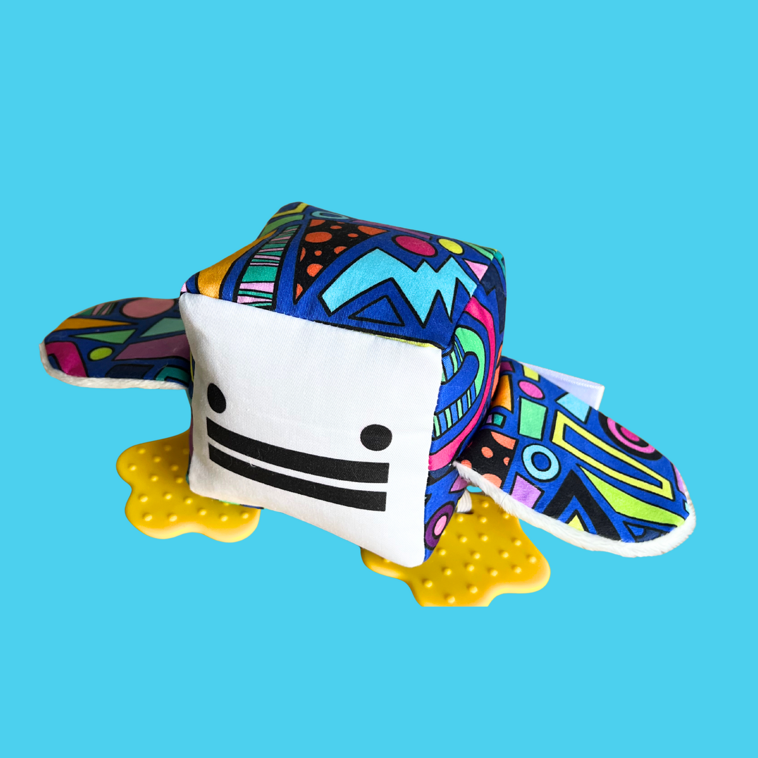 Eco-friendly and Australian-made handmade baby sensory toy — bright 80's pattern duck with soft fabric wings and safe chewable teething feet. Montessori-inspired toy for babies to encourage sensory development, teething relief, and independent play. Perfect unique baby shower gift for new parents.